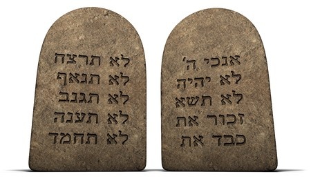 ten commandments on stone tablets isolated on a white background